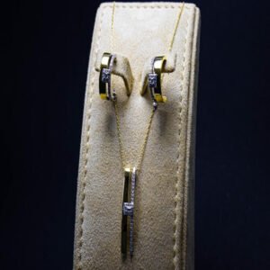 earring and necklace half set with gold and white diamond